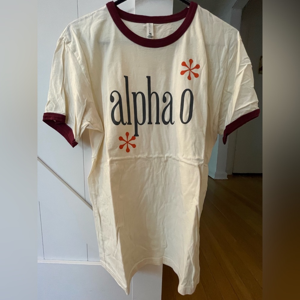 AOII beige/cream color short sleeve top.